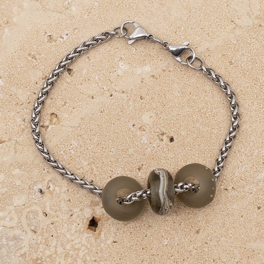 Bracelet with three frosted grey glass beads on a stainless steel chain