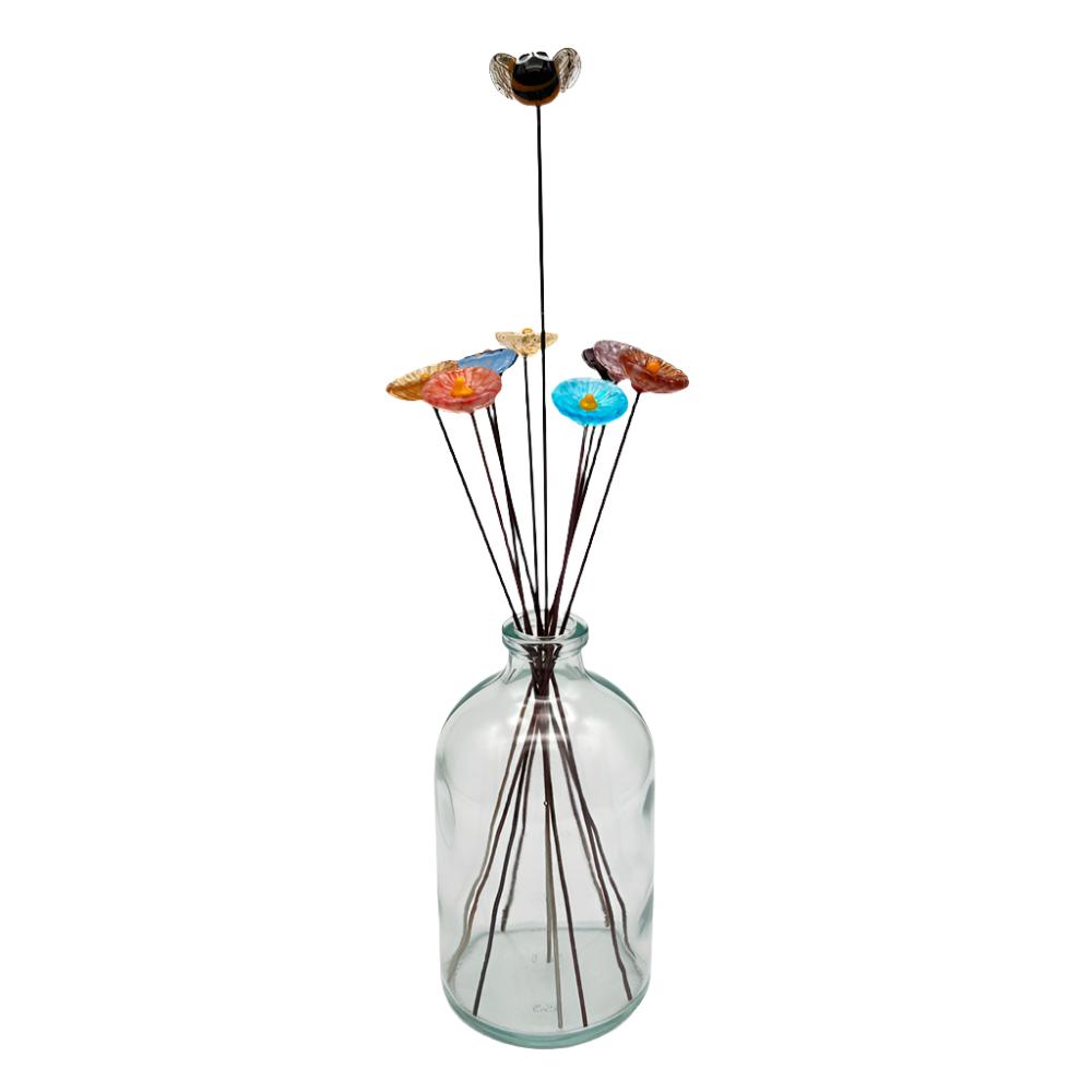 glass bee and nine daisy flowers in a vase full length